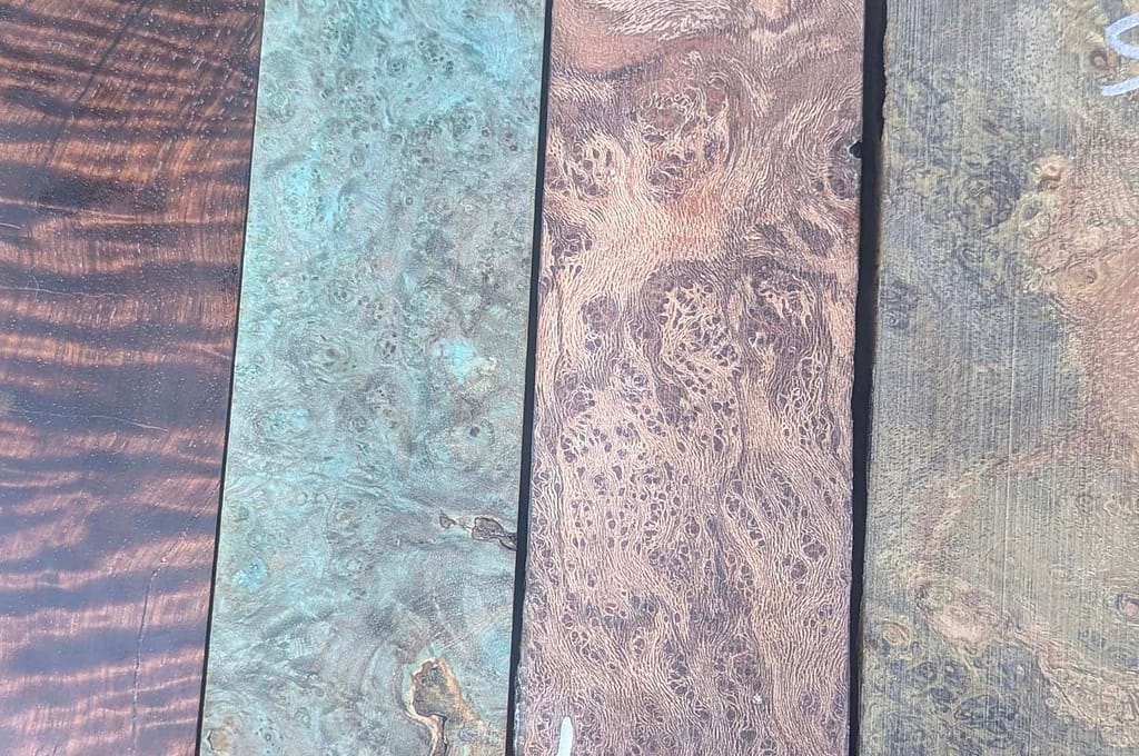 Stabilised wood handle blocks, left to right, curly narra, dyed ash burl, london plane burl